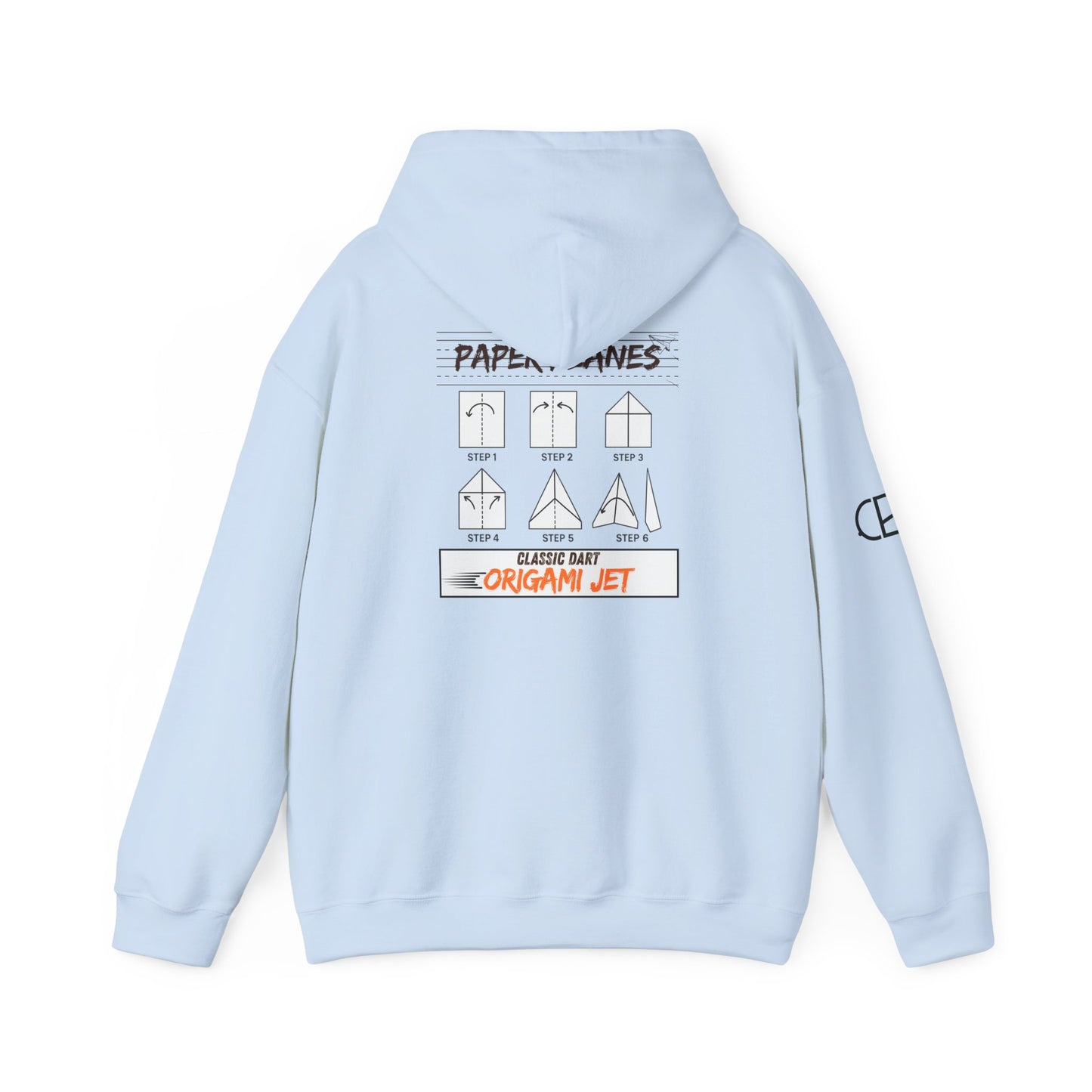 Light Blue pullover hoodie featuring the Paper Planes folding guide graphic with paper airplane instructions, New York City-inspired "Origami Jet" artwork, and a CB logo on the sleeve.