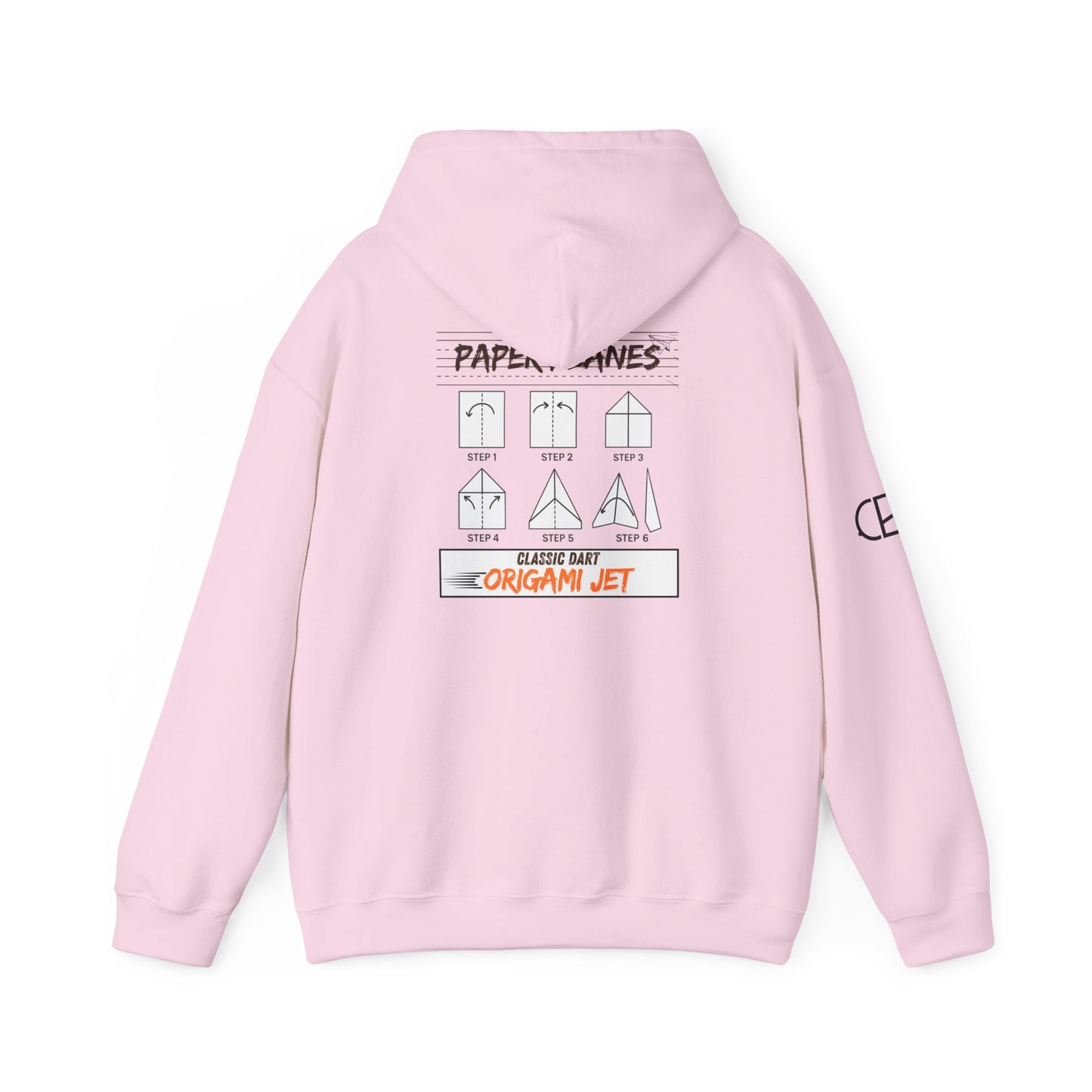 Light Pink pullover hoodie featuring the Paper Planes folding guide graphic with paper airplane instructions, New York City-inspired "Origami Jet" artwork, and a CB logo on the sleeve.